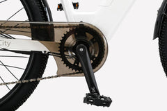 Close-up of the Cysum X-City Electric Bike crankset and pedal system with full chain guard protection, shown in white frame β available at Pogo Cycles UK under cycle to work scheme.