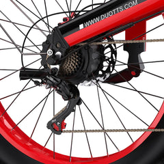 Close-up of a DUOTTS N26 Electric bicycle wheel with red rim and black components on a white background.