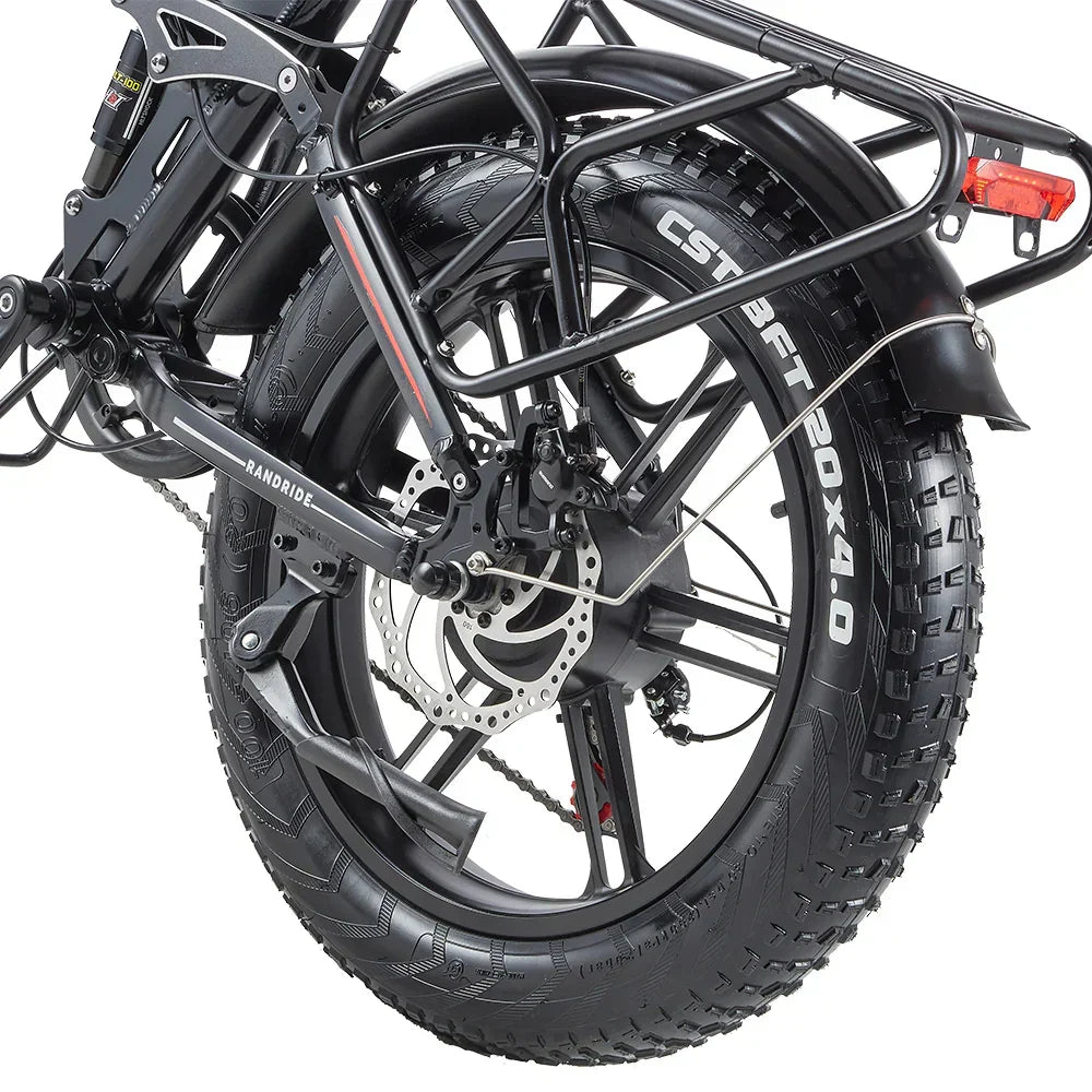 Close-up of a RANDRIDE YX20M-2 Dual Motor Electric motorcycle tire with suspension and chain mechanism on a white background