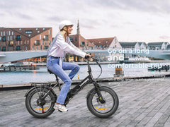A Lady riding Samebike LOTDM200-II Electric Bike near a lake.