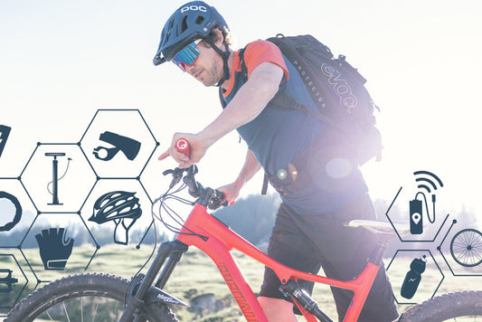 Mountain biker riding a red electric bike outdoors, wearing helmet and backpack, side view
