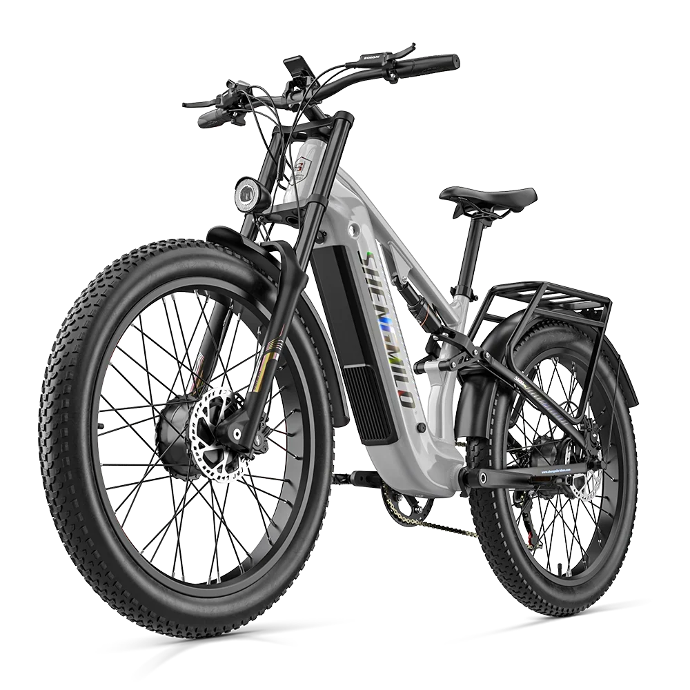 A silver and black Shengmilo S600Pro Dual Motor electric fat tire bike with a rear cargo rack, shown from a three-quarter front angle on a white background.