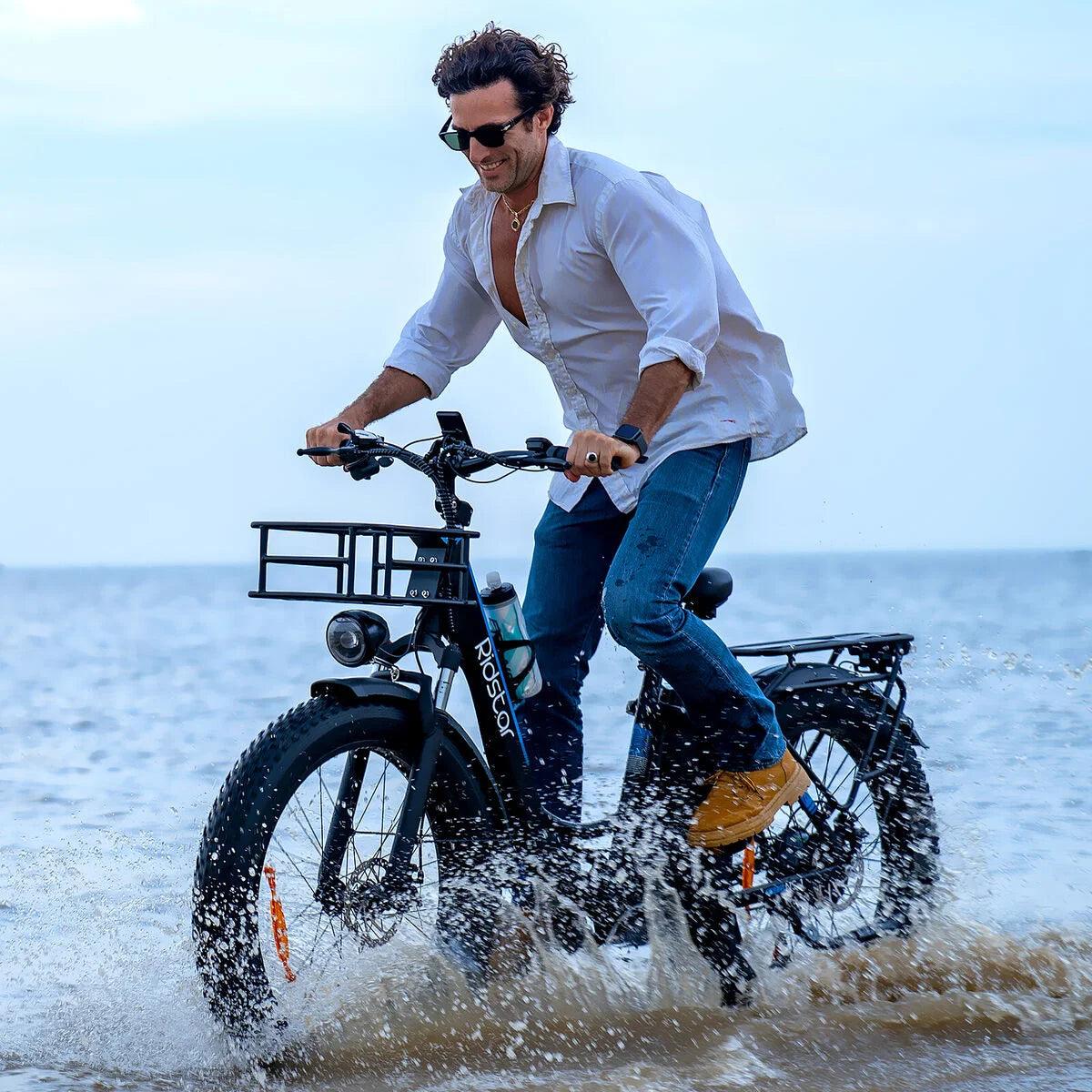 Ridstar MN26 Electric Bike - A person riding Ridstar on a beach happily enjoying the ride. 
